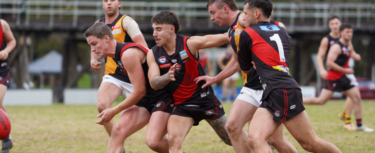 Two players contest a ruck in an Eltham game
