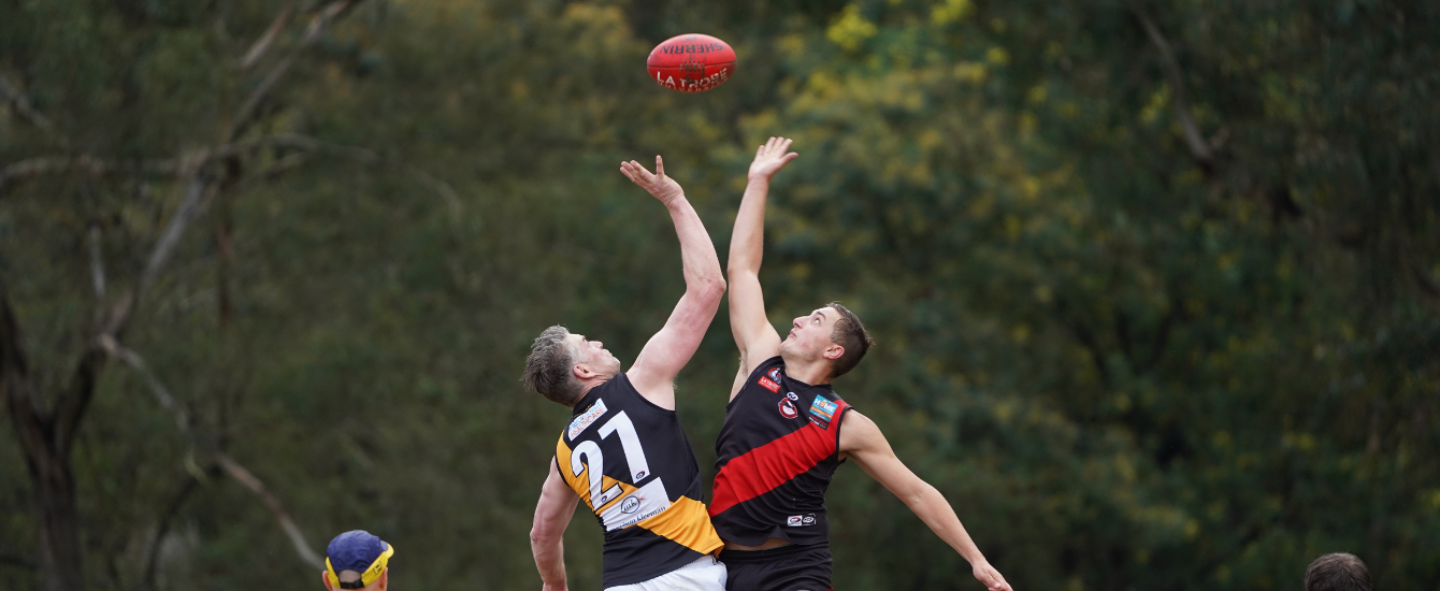 Two players contest a ruck in an Eltham game